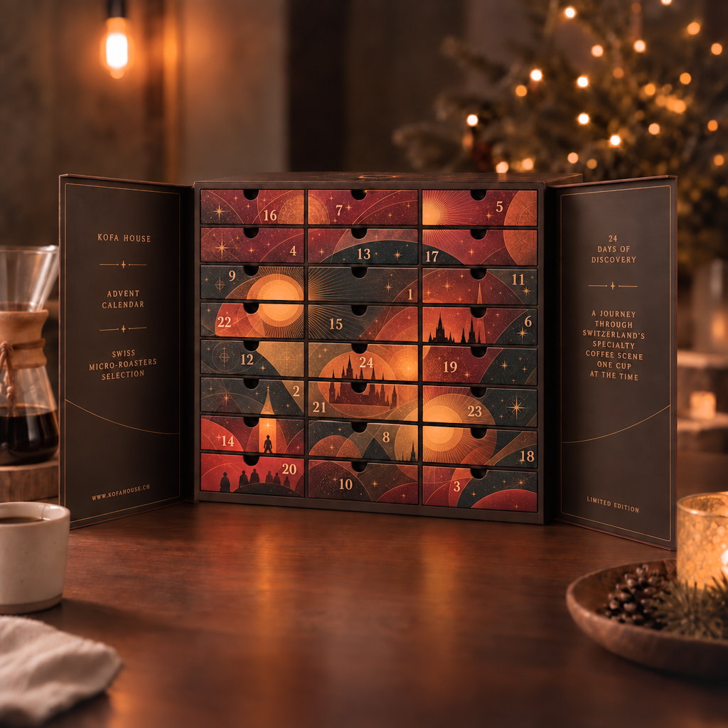 The open Kofa House advent calendar with all 24 drawers beside a Christmas tree